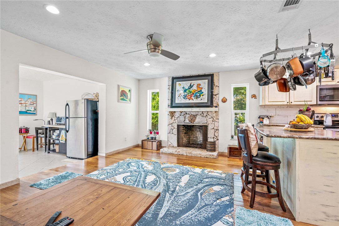 5313 Palm Drive Fort Pierce, FL 34982 - Photo 14 of 36 a living room with furniture and a fireplace
