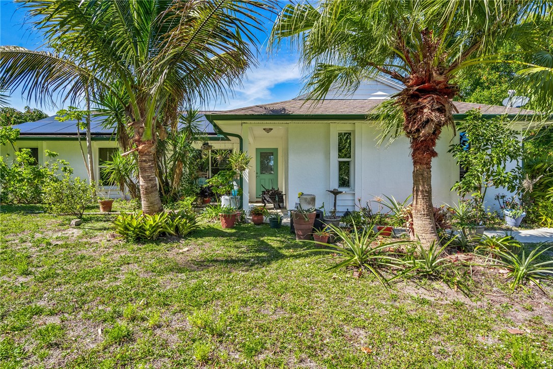 5313 Palm Drive Fort Pierce, FL 34982 - Photo 2 of 36 a view of a house with a yard