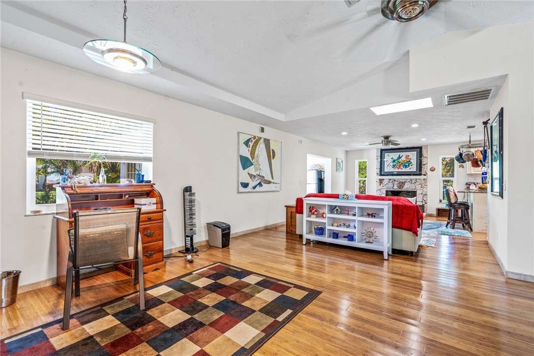 5313 Palm Drive Fort Pierce, FL 34982 - Photo 21 of 36 a living room with furniture and a wooden floor
