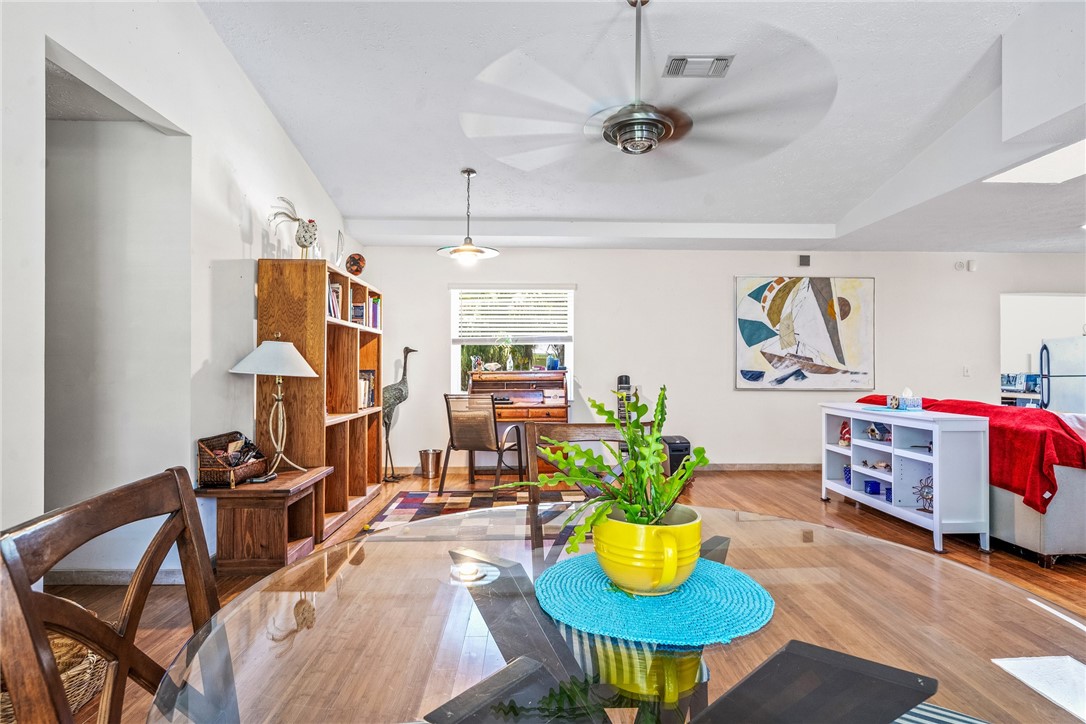 5313 Palm Drive Fort Pierce, FL 34982 - Photo 24 of 36 a living room with furniture and a chandelier