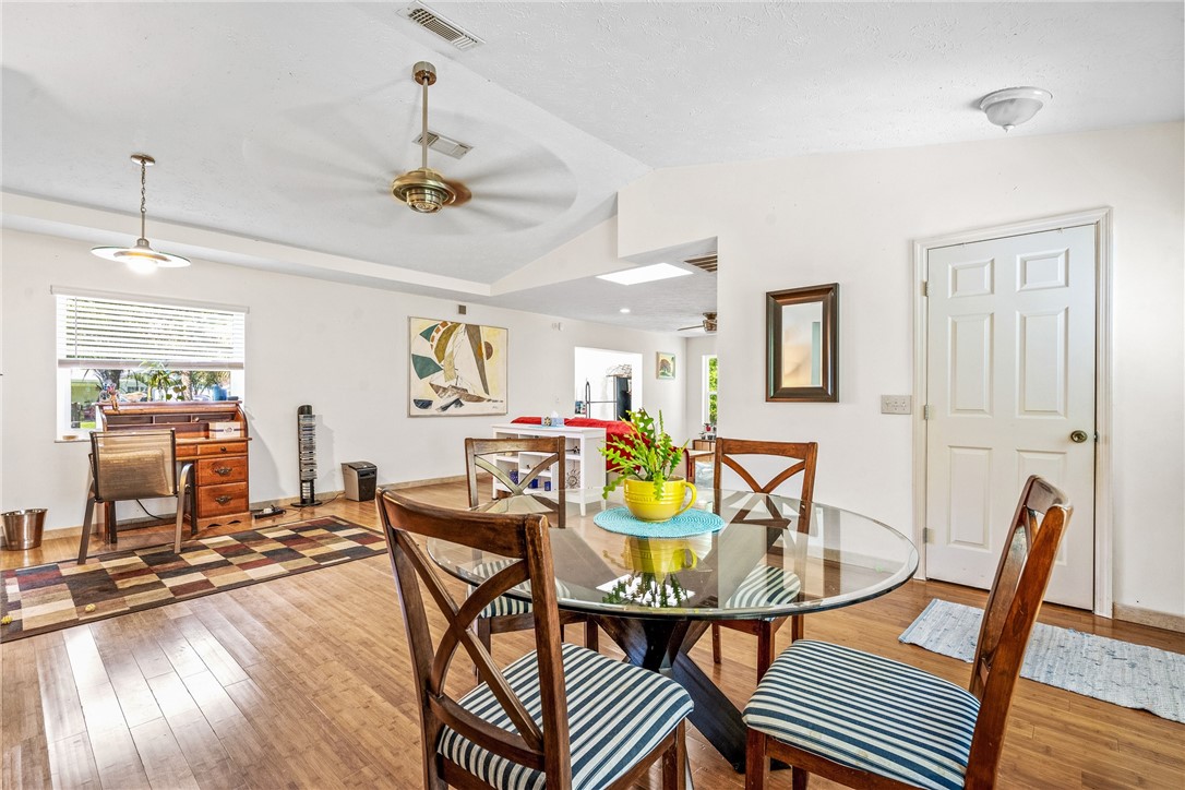 5313 Palm Drive Fort Pierce, FL 34982 - Photo 25 of 36 a view of a dining room with furniture and wooden floor