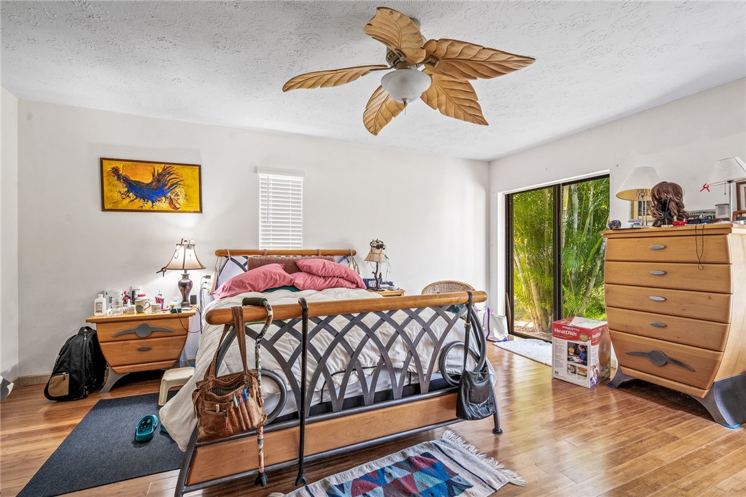 5313 Palm Drive Fort Pierce, FL 34982 - Photo 27 of 36 a bedroom with a bed and a cabinets