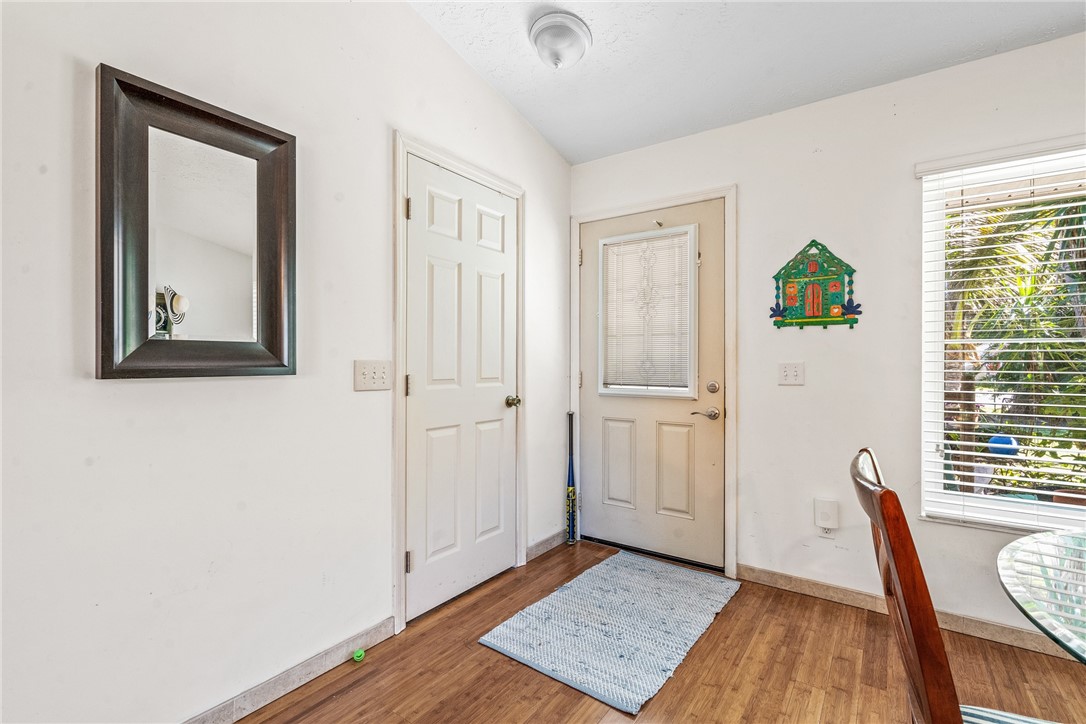 5313 Palm Drive Fort Pierce, FL 34982 - Photo 32 of 36 a view of an empty room with wooden floor and a window