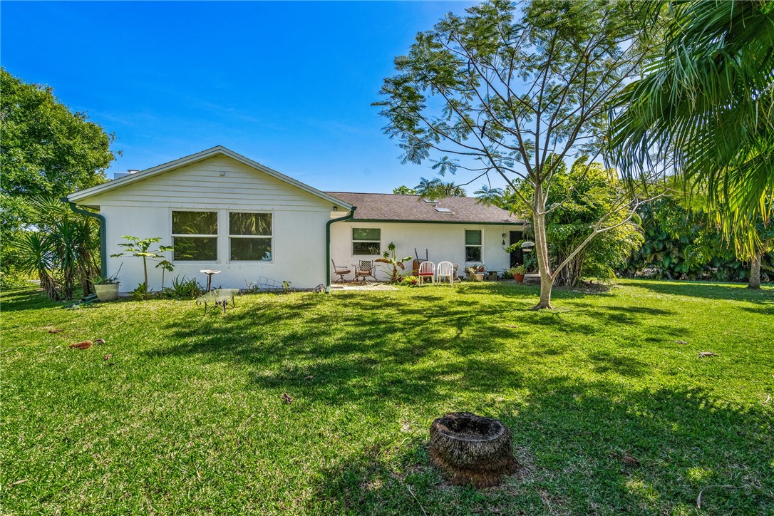 5313 Palm Drive Fort Pierce, FL 34982 - Photo 35 of 36 a front view of a house with a yard