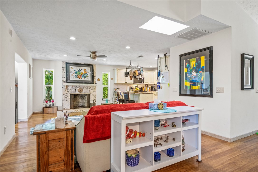 5313 Palm Drive Fort Pierce, FL 34982 - Photo 5 of 36 a living room with furniture and a fireplace