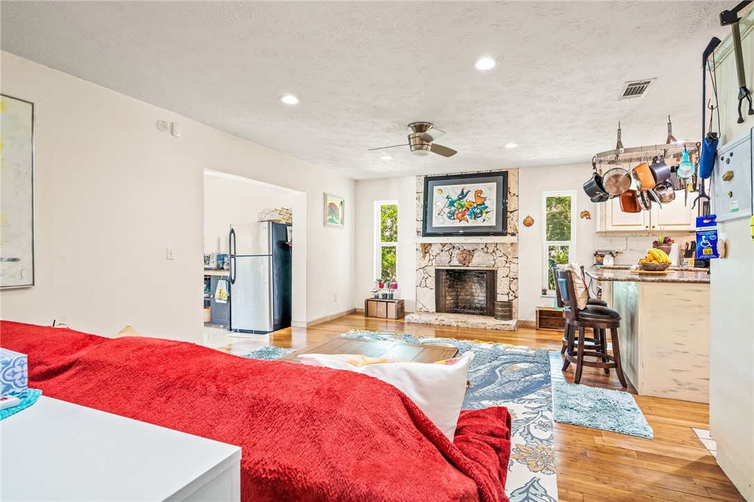 5313 Palm Drive Fort Pierce, FL 34982 - Photo 6 of 36 a living room with furniture and a fireplace