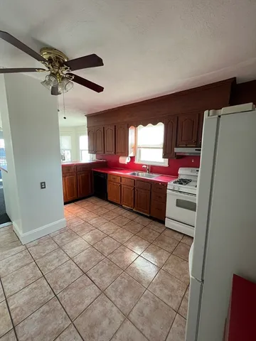 a kitchen with stainless steel appliances a stove a sink and a microwave