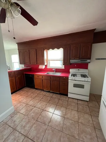 a kitchen with a cabinets and white stainless steel appliances