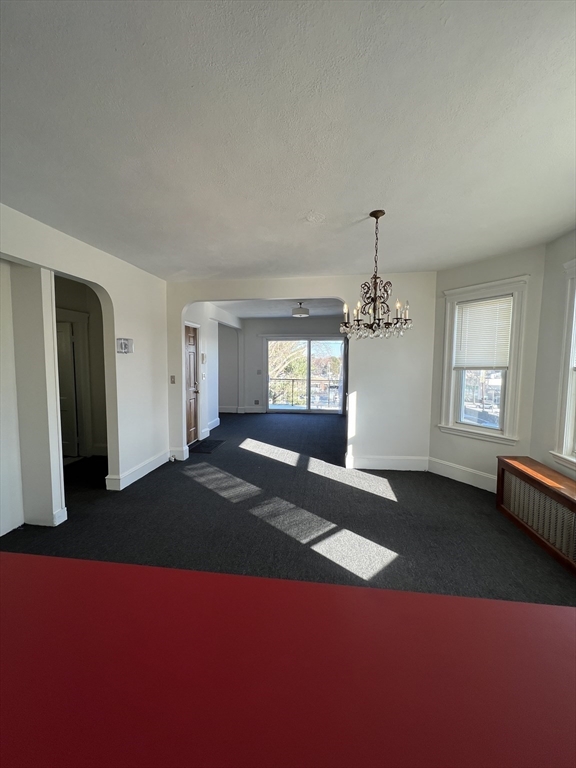 8 Irma Avenue, Unit 2 Watertown, MA 02472 - Photo 17 of 20 a bedroom with a bed and a window