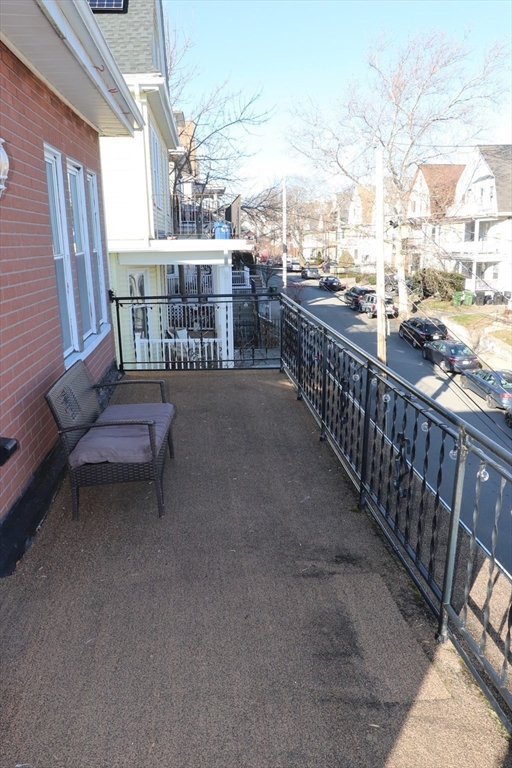 8 Irma Avenue, Unit 2 Watertown, MA 02472 - Photo 19 of 20 a view of a chairs and table in the balcony