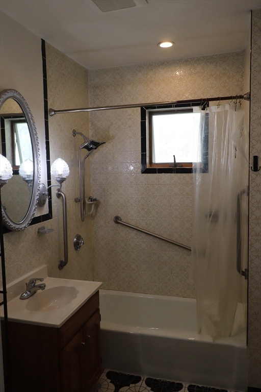 8 Irma Avenue, Unit 2 Watertown, MA 02472 - Photo 20 of 20 a bathroom with a sink and a mirror