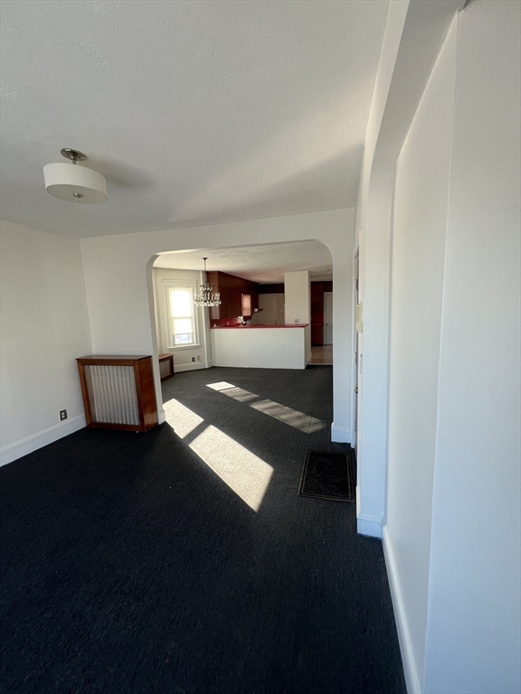8 Irma Avenue, Unit 2 Watertown, MA 02472 - Photo 3 of 20 a view of an empty room and window