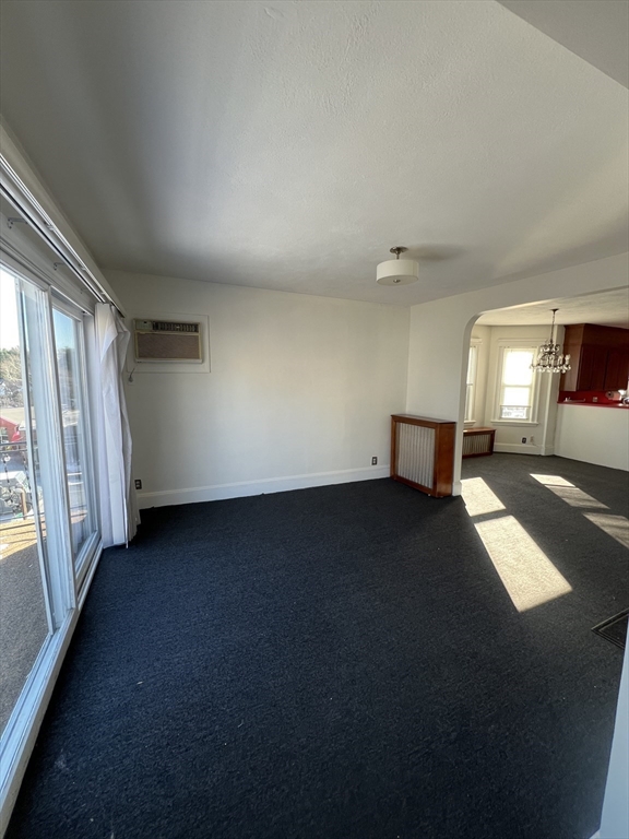 8 Irma Avenue, Unit 2 Watertown, MA 02472 - Photo 4 of 20 a view of an empty room and window