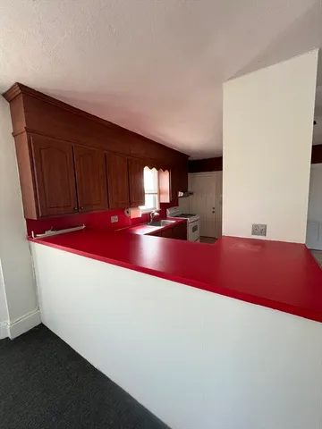 a kitchen with stainless steel appliances a refrigerator and a sink