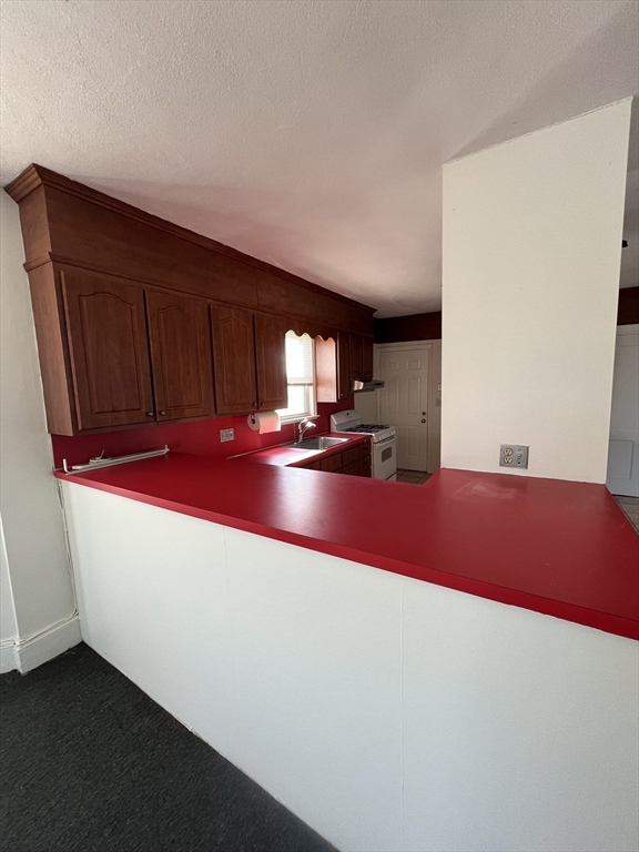 8 Irma Avenue, Unit 2 Watertown, MA 02472 - Photo 10 of 20 a room with pool table gym equipment wooden floor and window