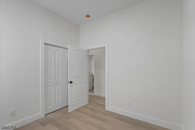 an empty room with wooden floor