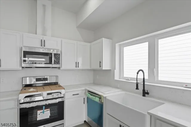 a kitchen with a stove and a sink