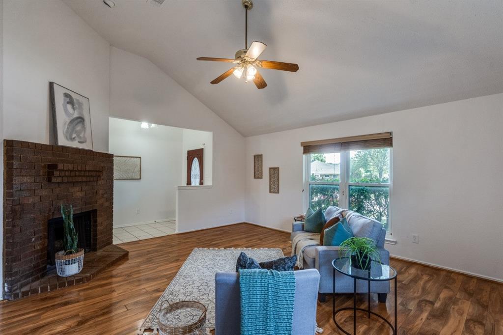 1509 Clover Drive Allen, TX 75002 - Photo 8 of 25 a living room with furniture and a fireplace