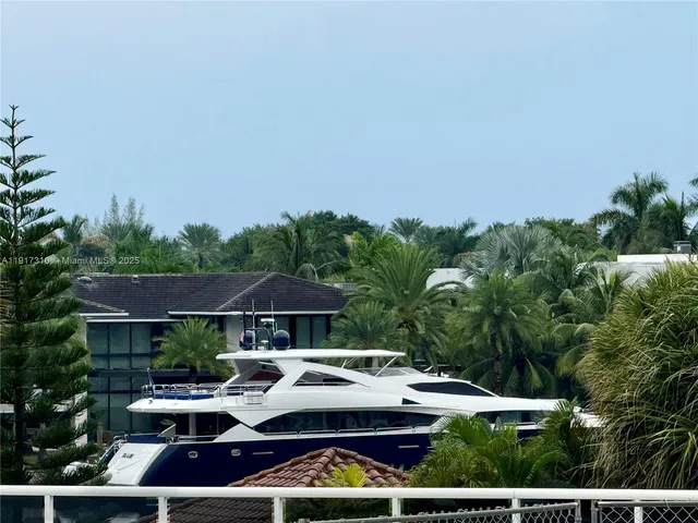 a view of house with yard and seating area