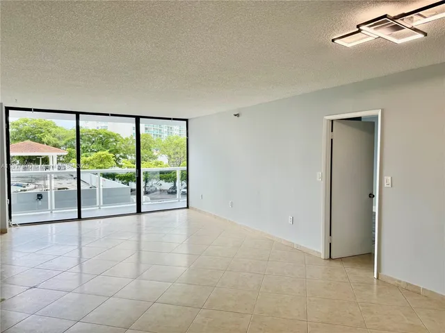 a view of an empty room with a sliding door