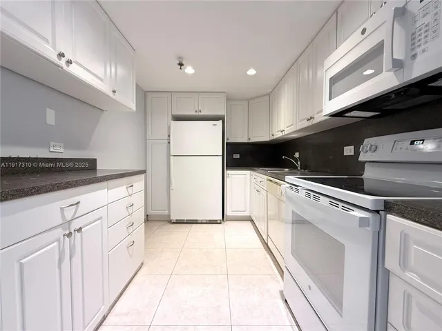 a view of hallway with wooden floor