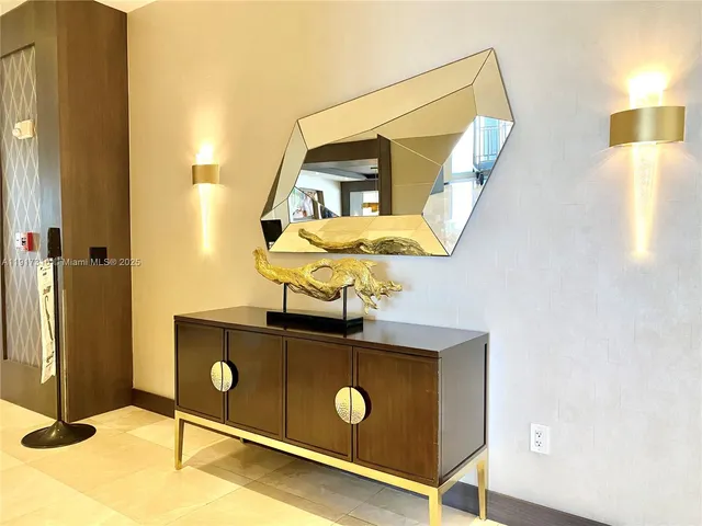 a view of a living room with a floor to ceiling window and wooden floor
