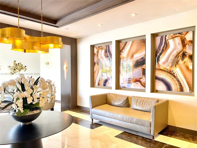 a living room with furniture and flat screen tv