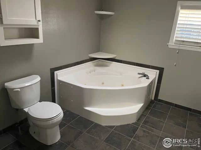 a bathroom with a toilet and a sink