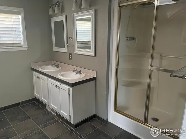 a utility room with cabinets washer and dryer
