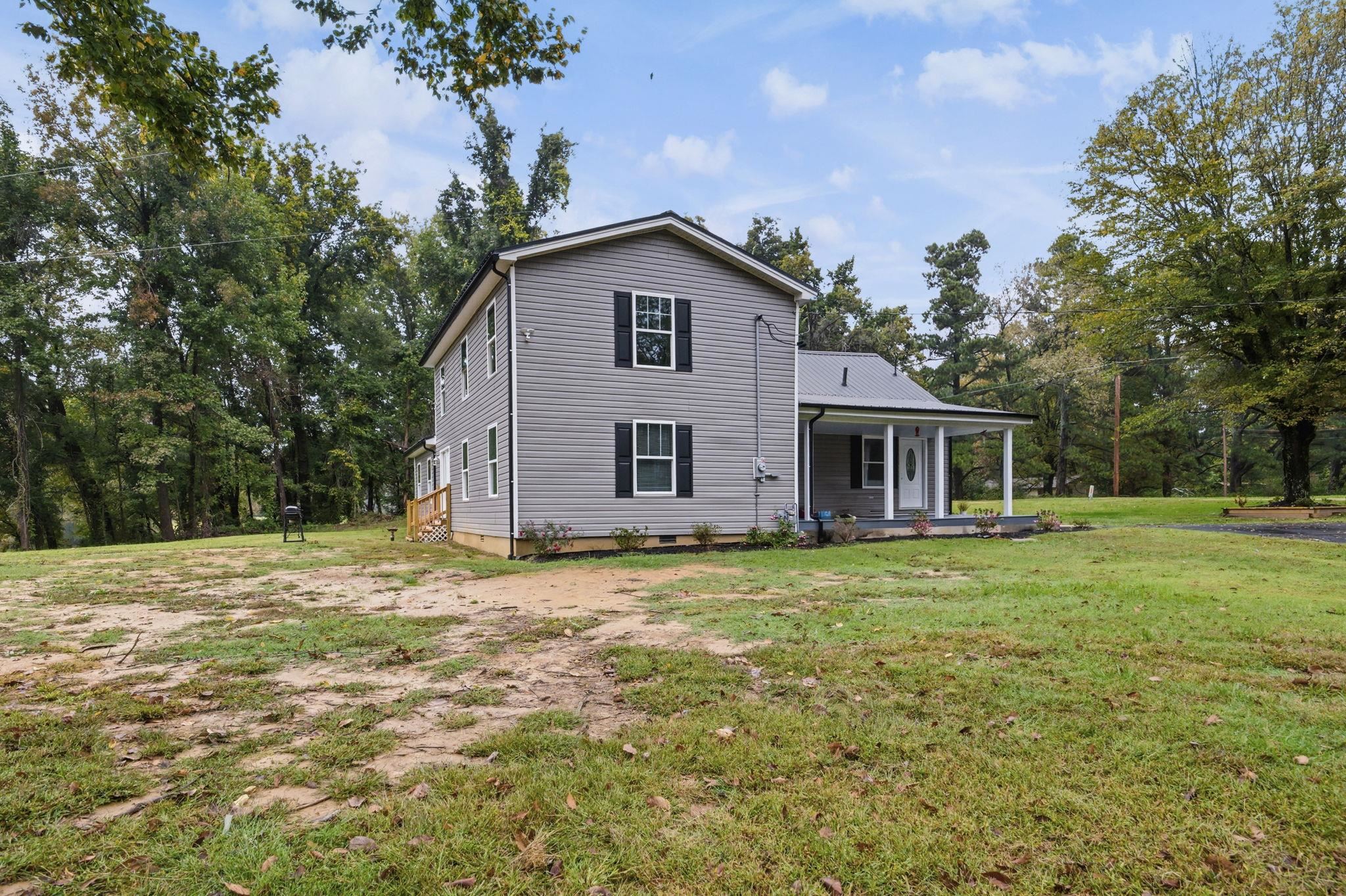 9509 Merrill Road Millington, TN 38053 - Photo 24 of 26 a view of a yard in front of a house with a large tree