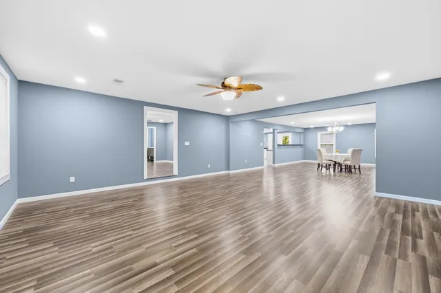 a view of livingroom and dining room with wooden floor
