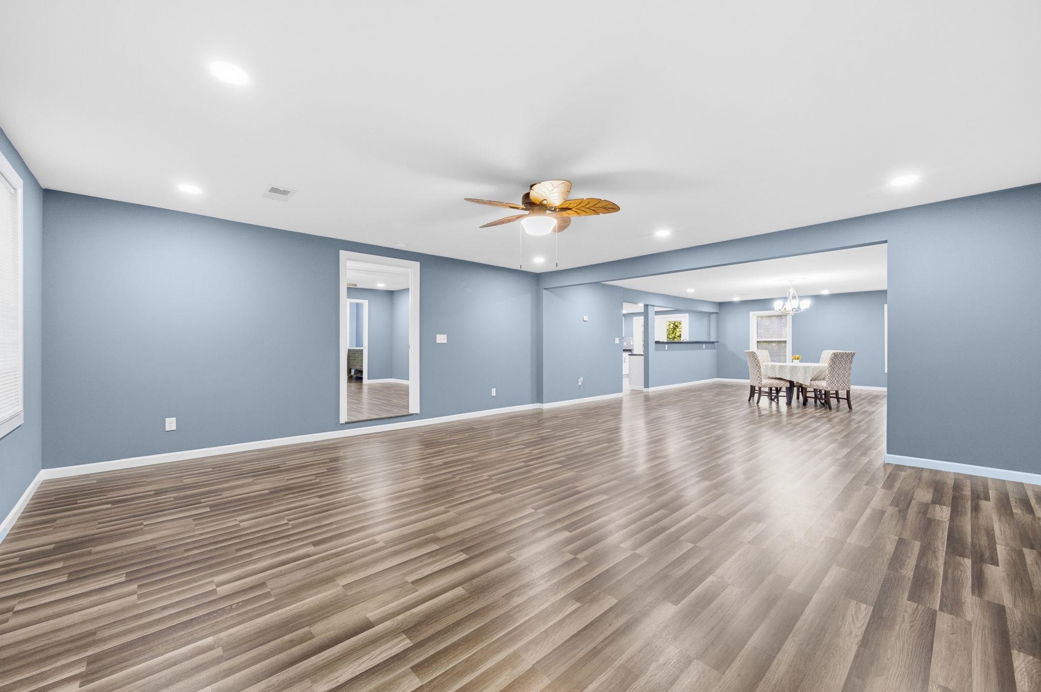 9509 Merrill Road Millington, TN 38053 - Photo 5 of 26 a view of livingroom and dining room with wooden floor
