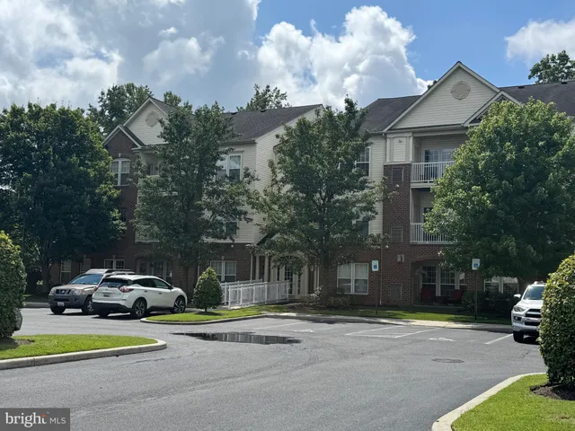 a view of a parked cars in front of a house