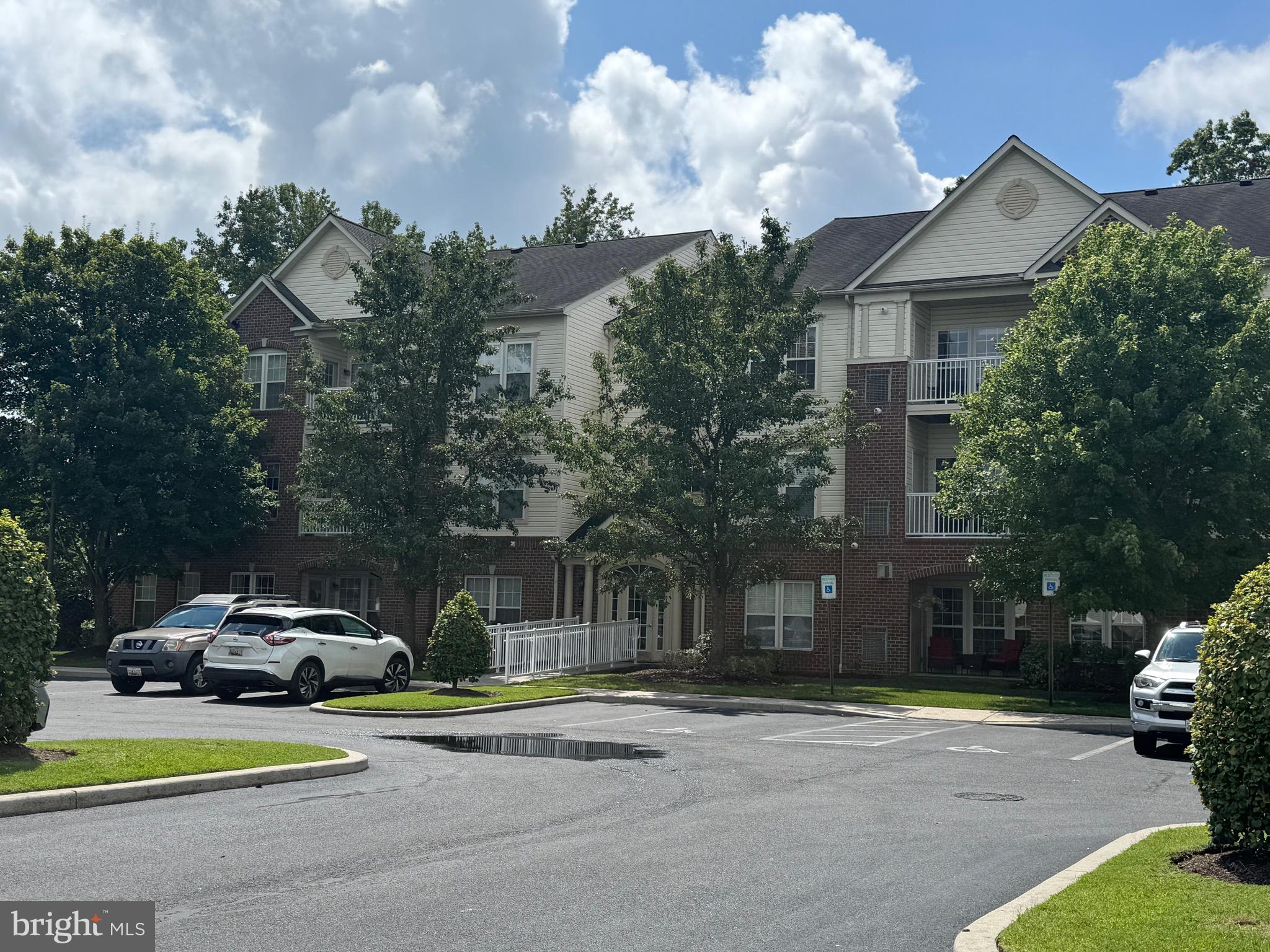 a view of a parked cars in front of a house