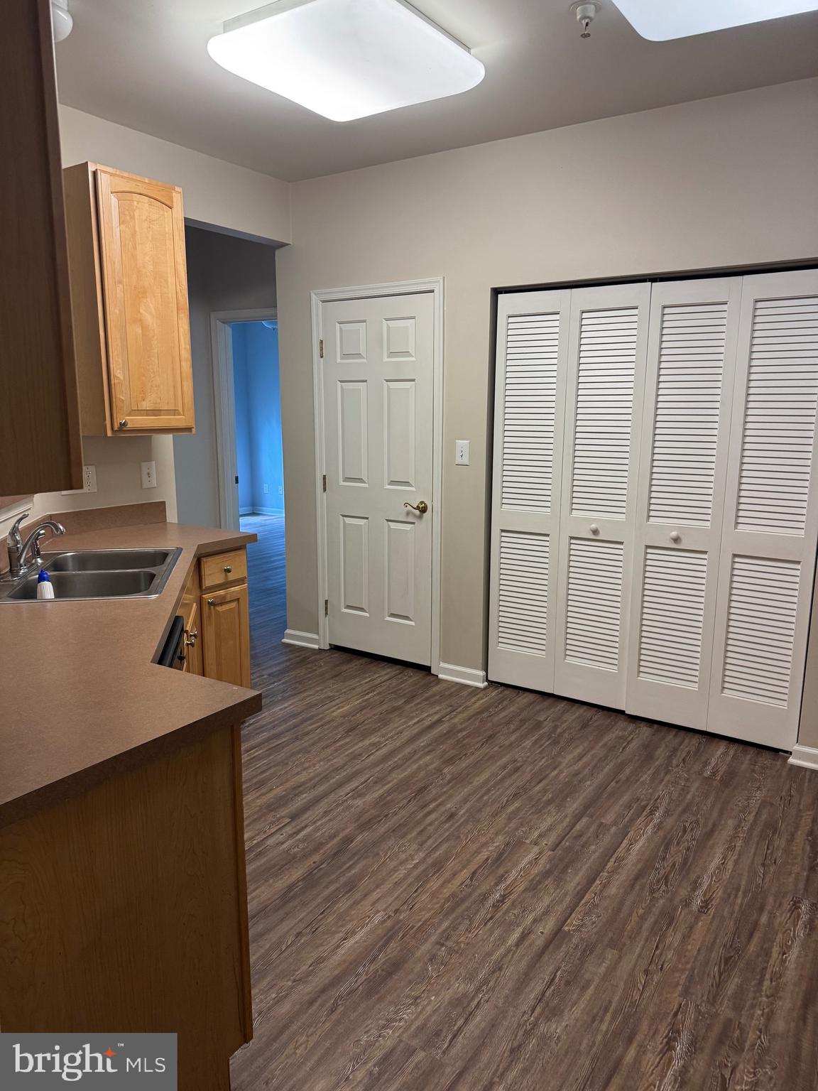 2003 Whispering Ponds Court, Unit 1C Salisbury, MD 21804 - Photo 10 of 12 wooden floor in an empty room