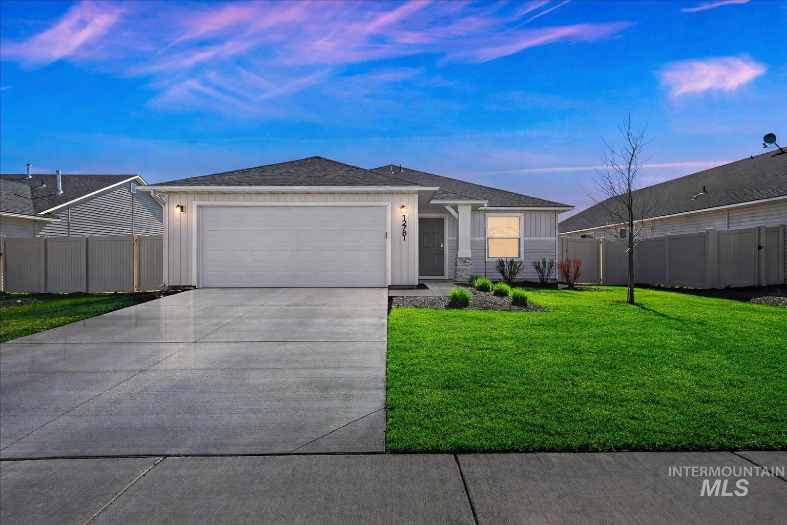 12781 Ashfield Street Caldwell, ID 83607 - Photo 2 of 36 Ranch-style home with roof with shingles, an attached garage, driveway, and board and batten siding