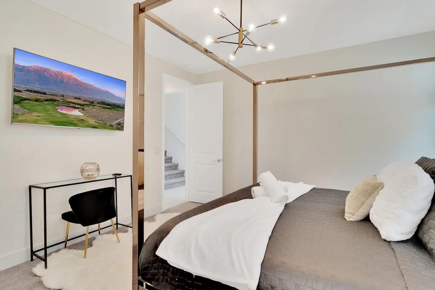 84635 Lago Brezza Drive Indio, CA 92203 - Photo 12 of 39 a bedroom with a bed and a table in it