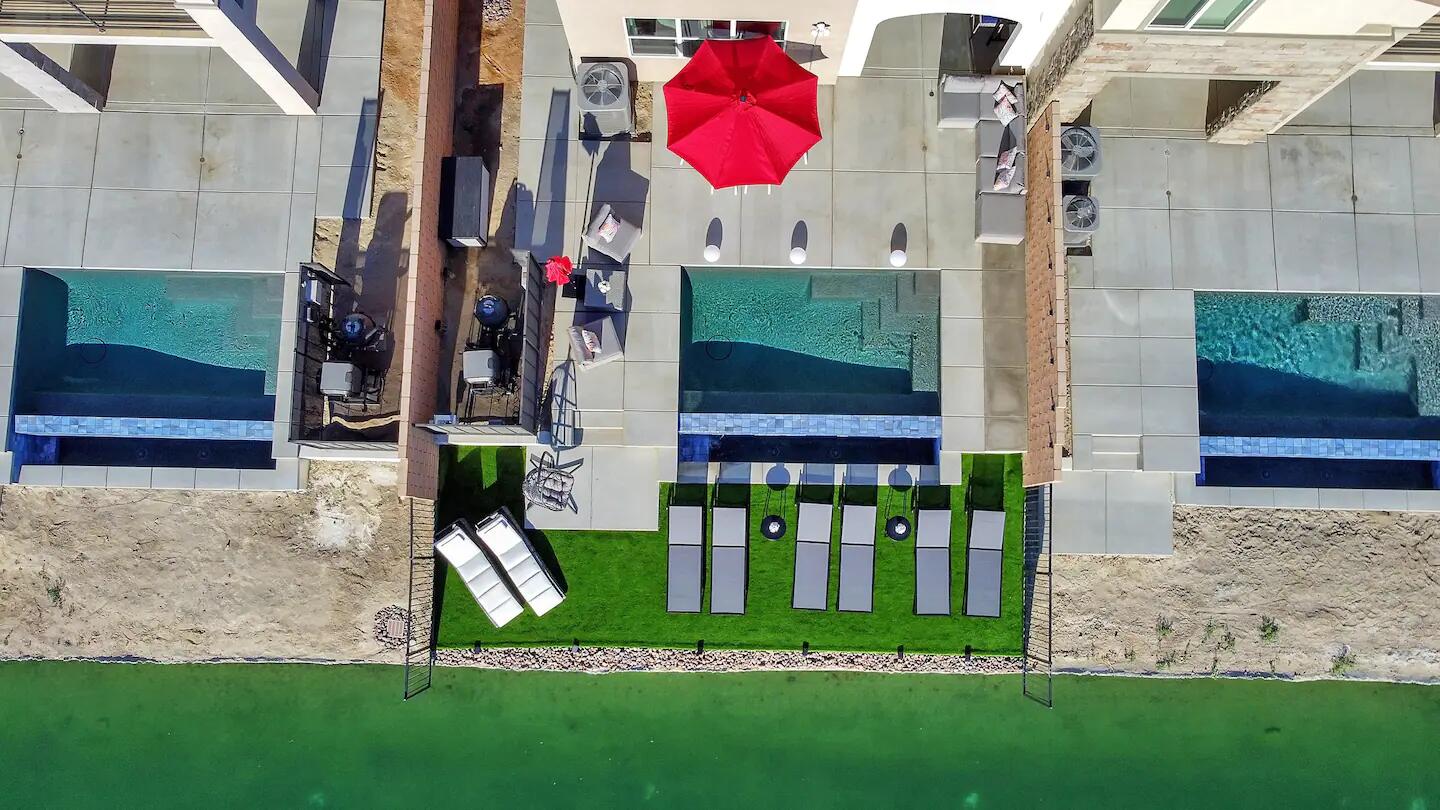 84635 Lago Brezza Drive Indio, CA 92203 - Photo 39 of 39 a view of brick house with a yard and plants