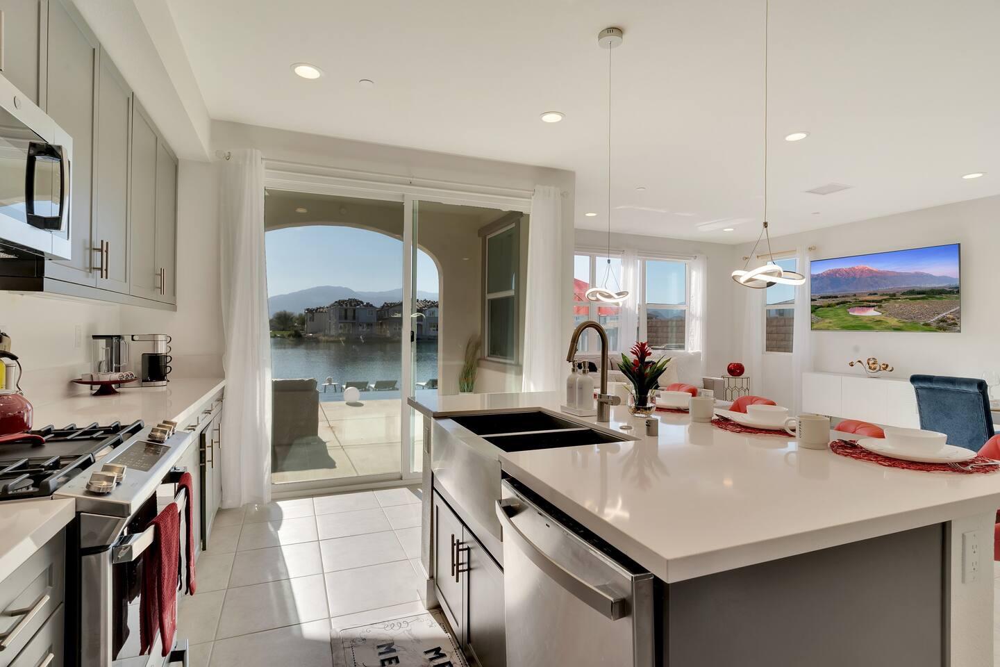 84635 Lago Brezza Drive Indio, CA 92203 - Photo 5 of 39 a kitchen with stainless steel appliances stove a sink and a refrigerator