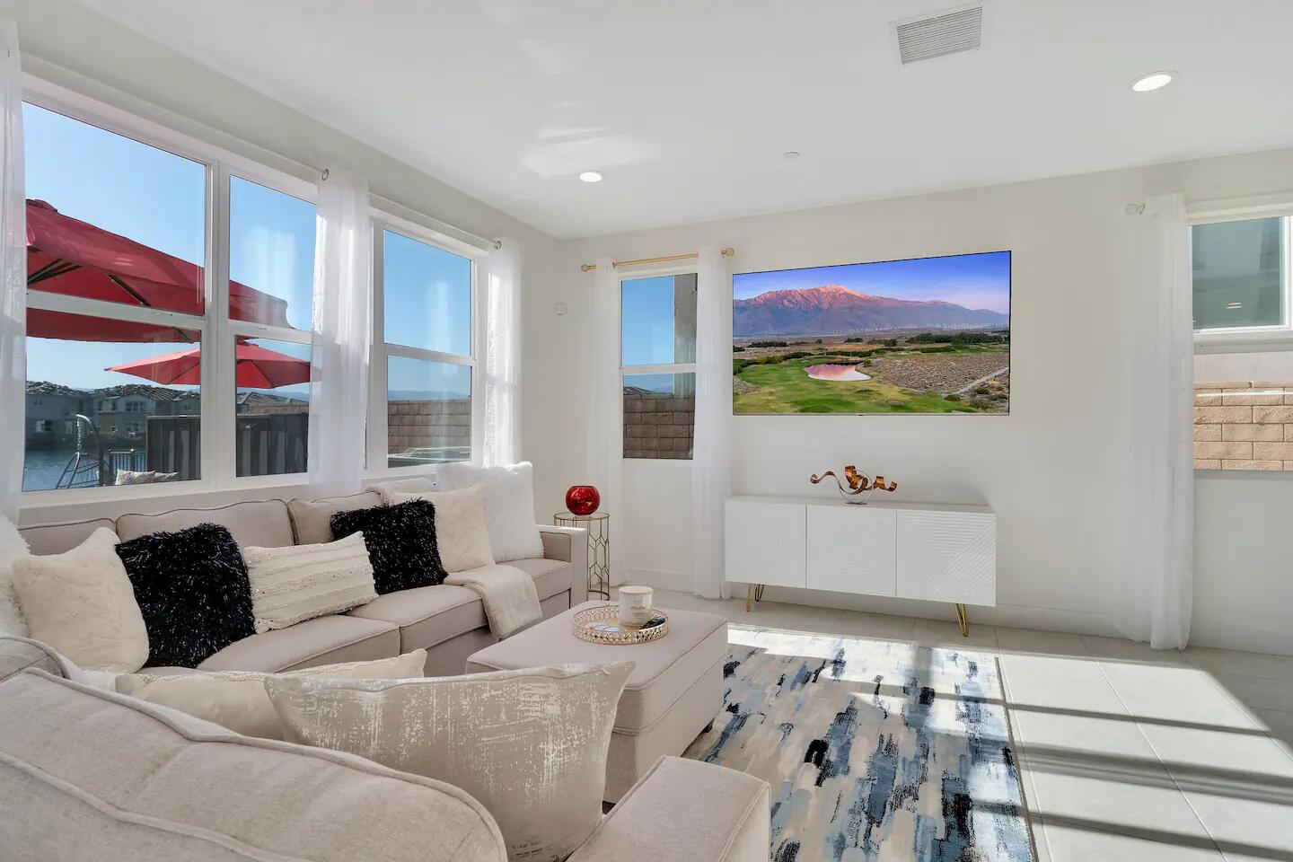 84635 Lago Brezza Drive Indio, CA 92203 - Photo 8 of 39 a living room with furniture and a large window