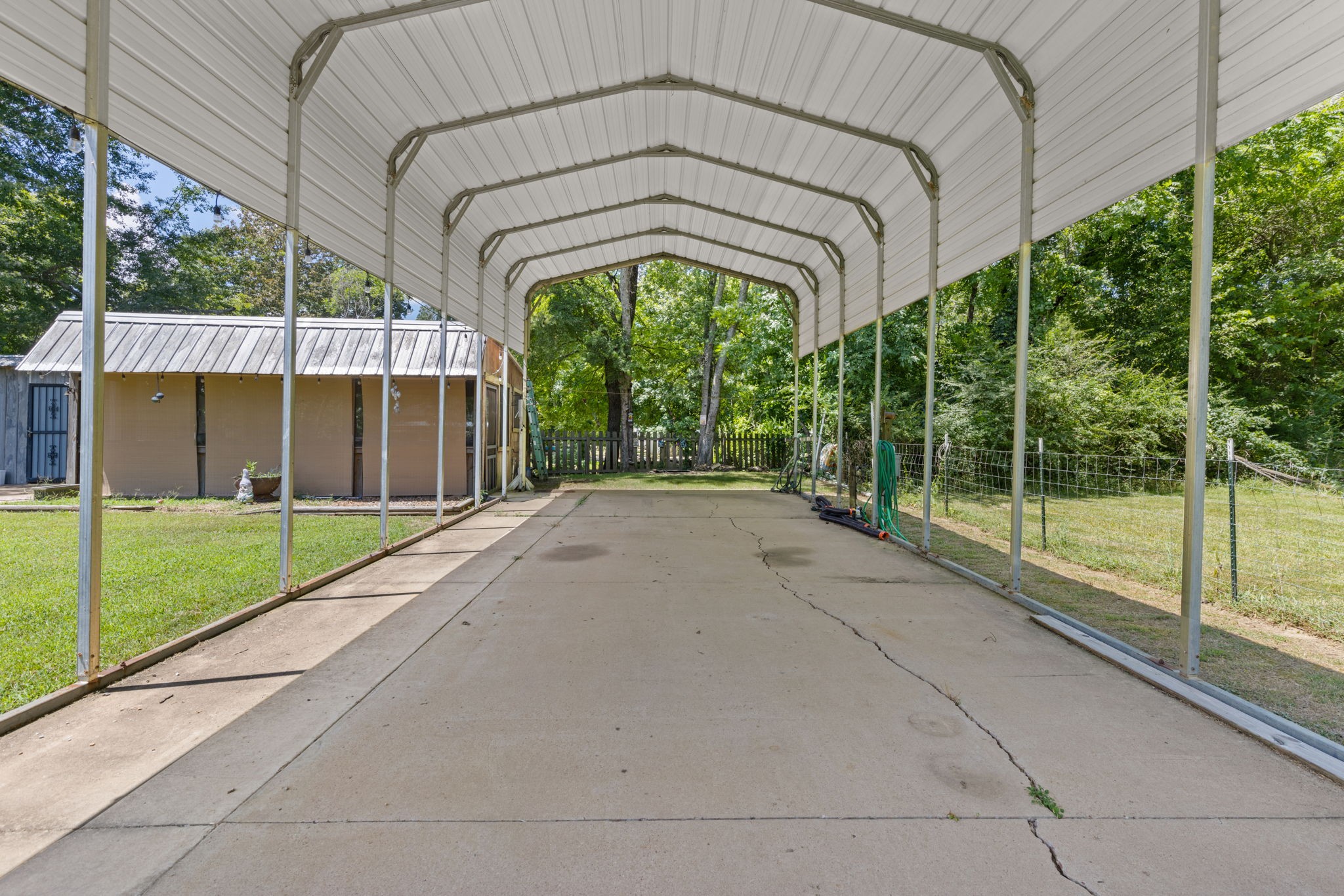 85 Bargeview Lane Adamsville, TN 38310 - Photo 18 of 44 a view of a house with a yard