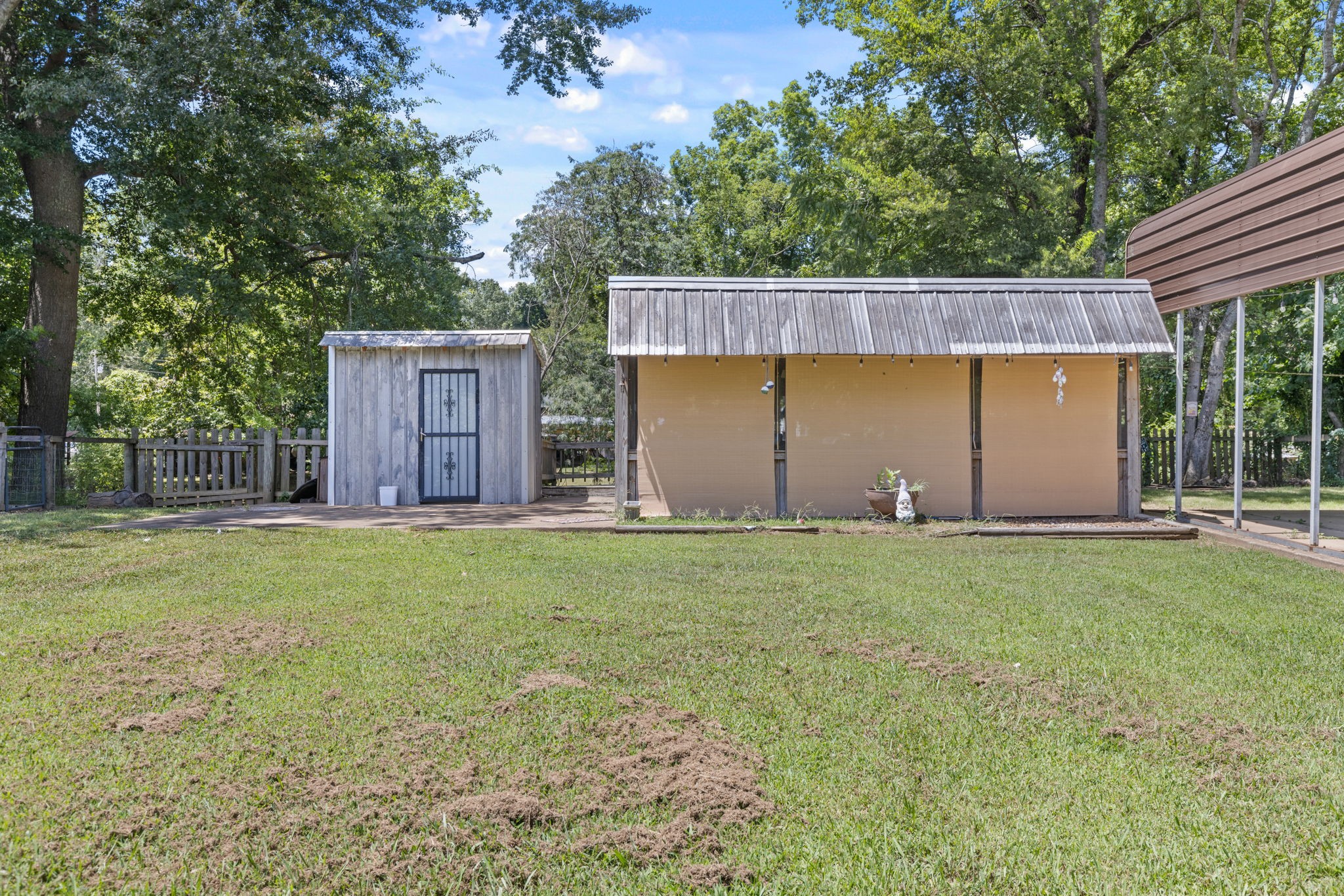 85 Bargeview Lane Adamsville, TN 38310 - Photo 2 of 44 a view of a house with backyard and garden