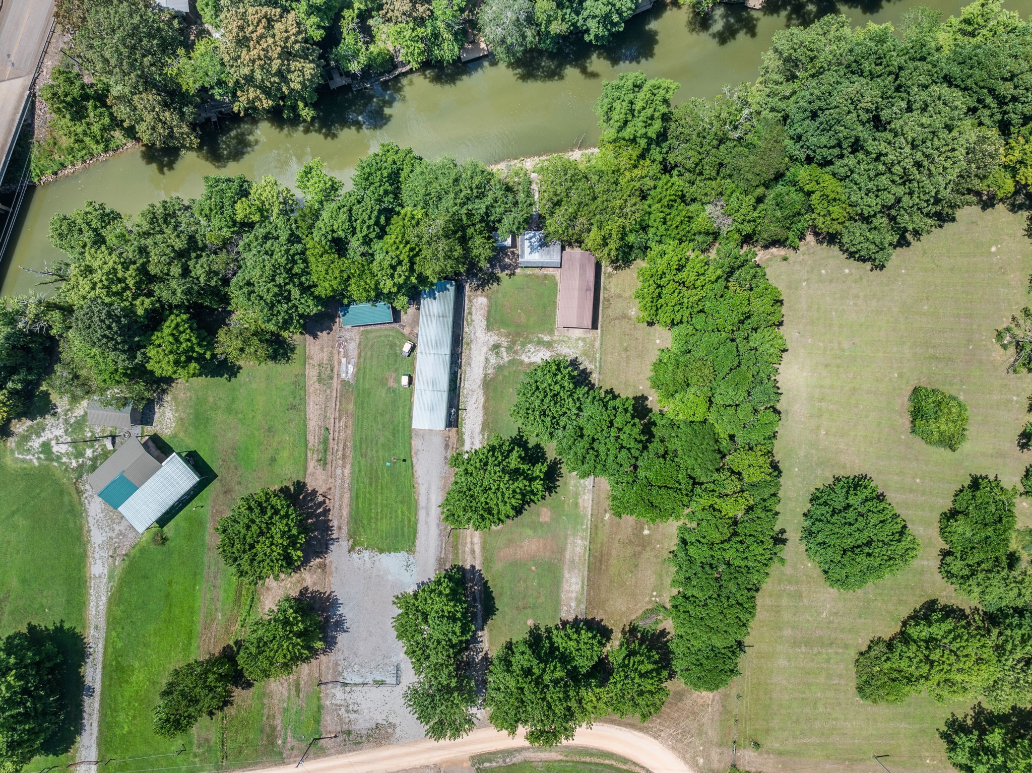 85 Bargeview Lane Adamsville, TN 38310 - Photo 21 of 44 an aerial view of a house with outdoor space and lake view