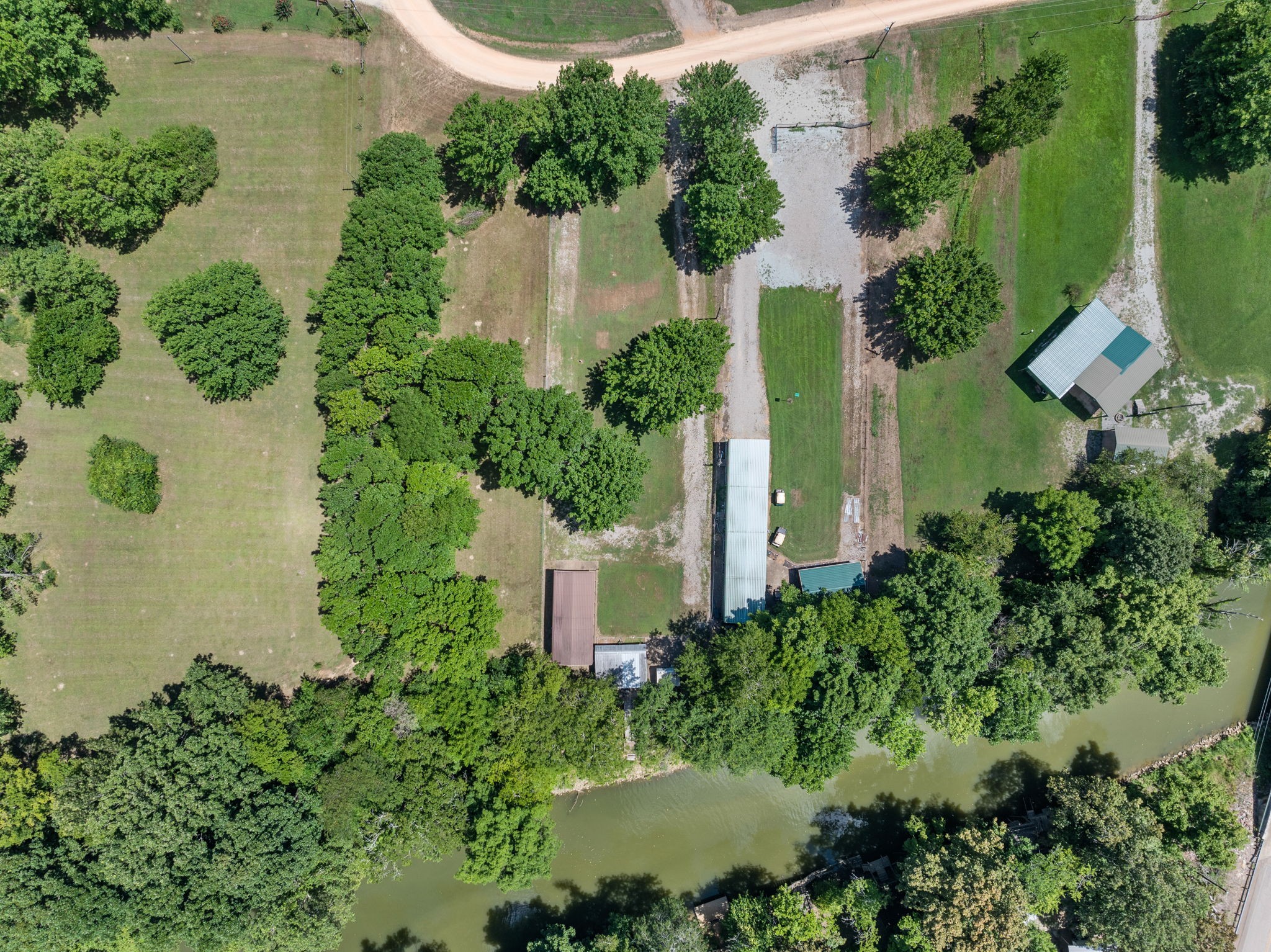 85 Bargeview Lane Adamsville, TN 38310 - Photo 23 of 44 an aerial view of a house with a yard and lake view