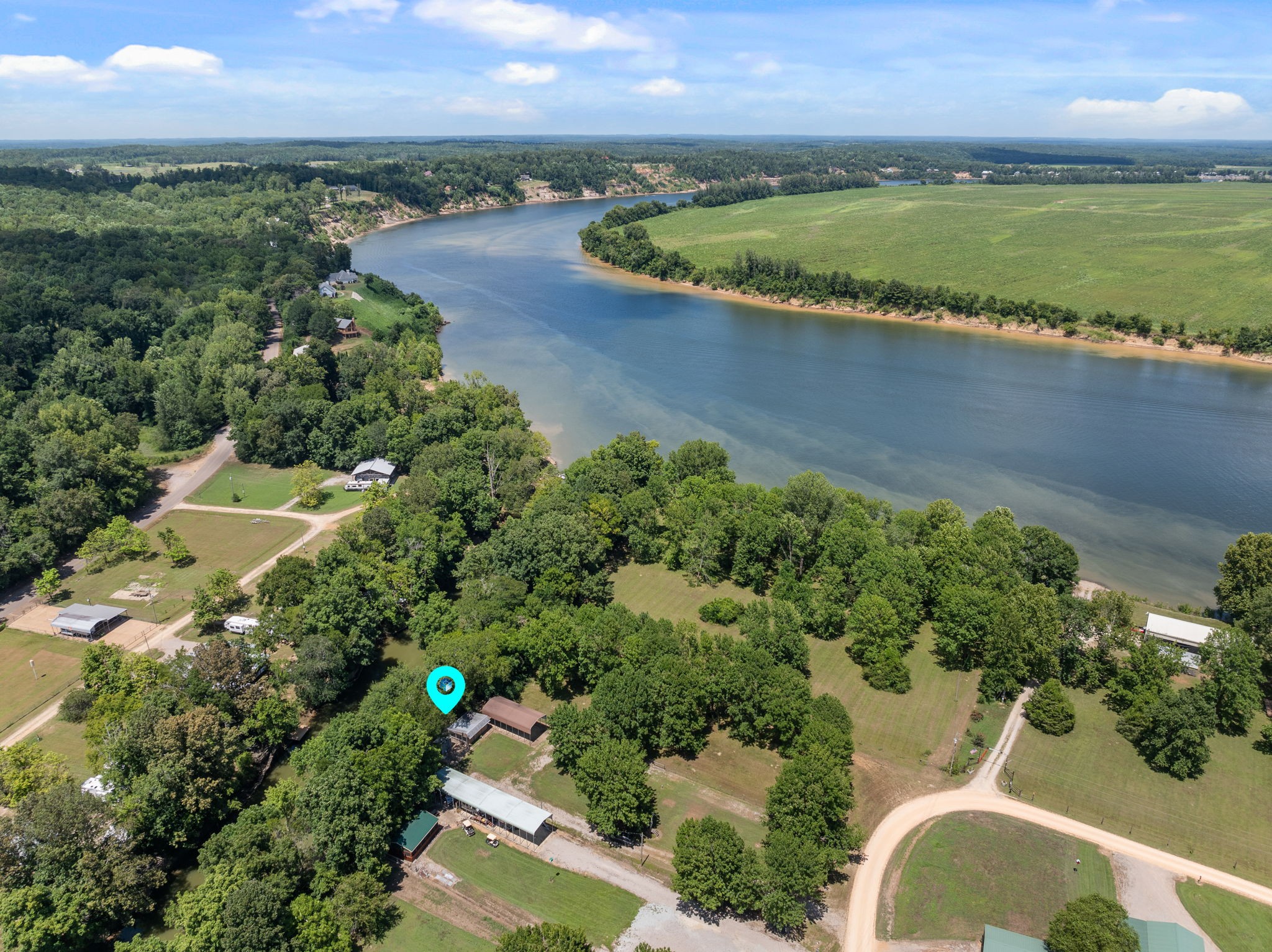 85 Bargeview Lane Adamsville, TN 38310 - Photo 24 of 44 an aerial view of a house with a yard and lake view