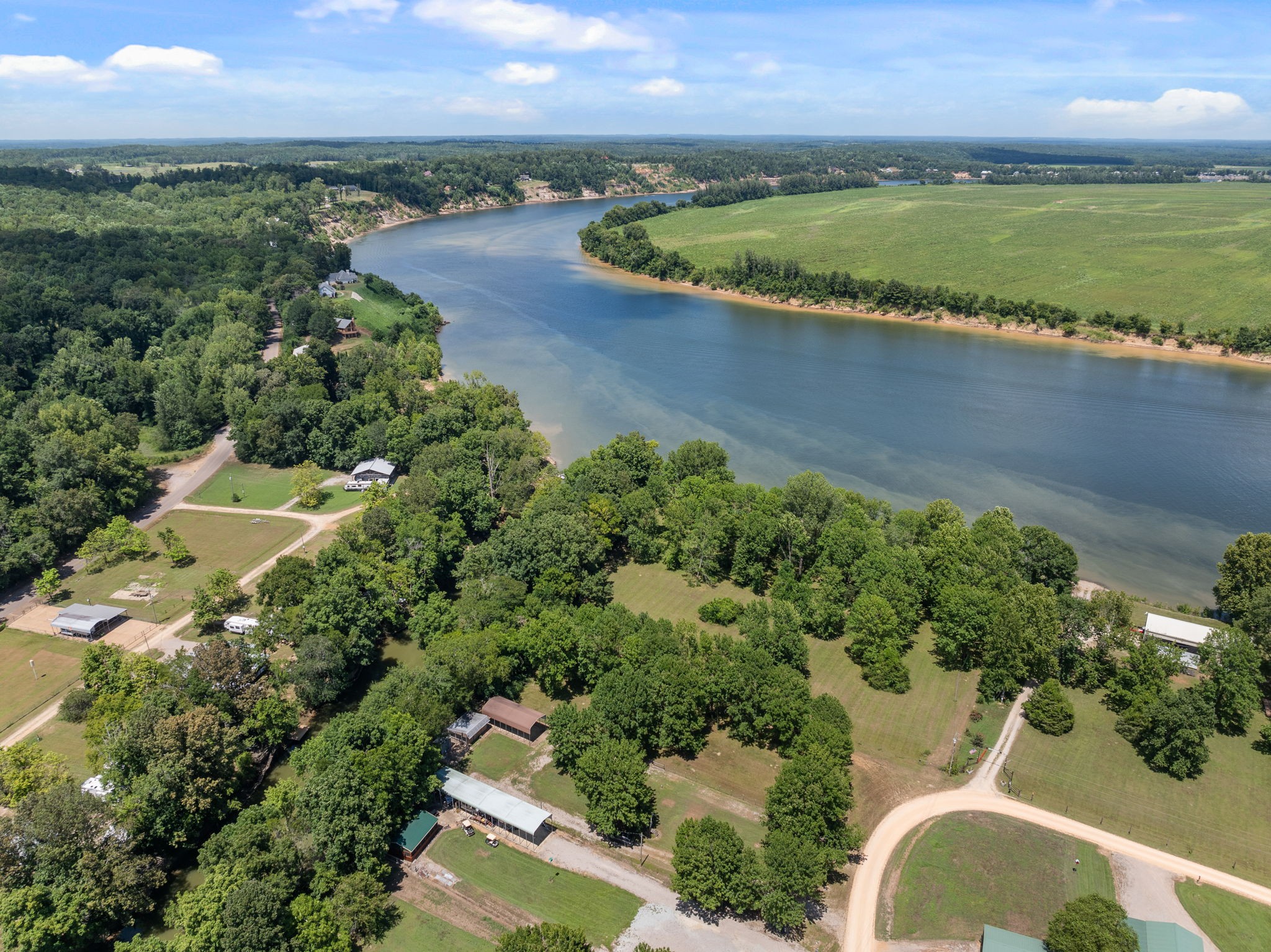85 Bargeview Lane Adamsville, TN 38310 - Photo 25 of 44 an aerial view of a house with a yard and lake view