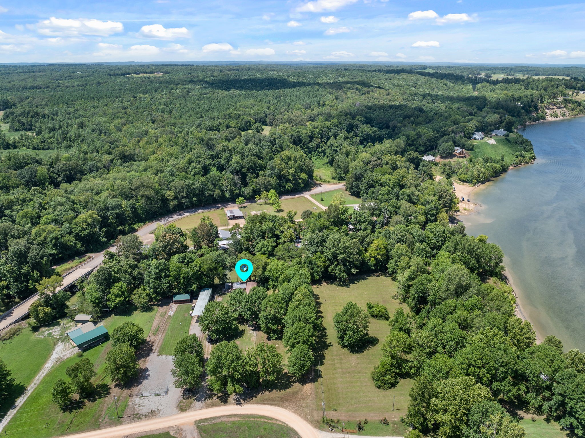 85 Bargeview Lane Adamsville, TN 38310 - Photo 26 of 44 an aerial view of a houses with a yard