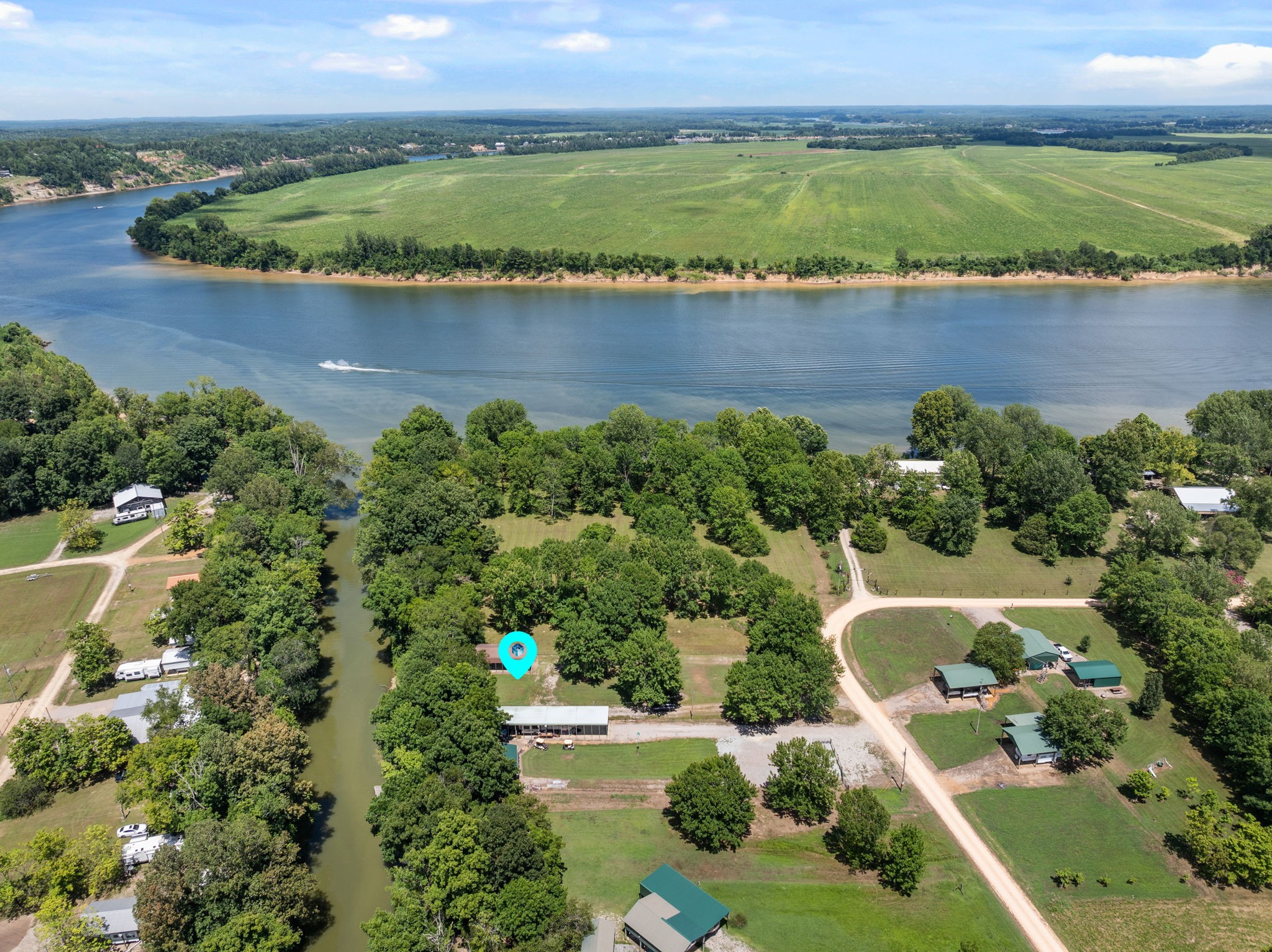 85 Bargeview Lane Adamsville, TN 38310 - Photo 28 of 44 an aerial view of residential houses with outdoor space and lake view
