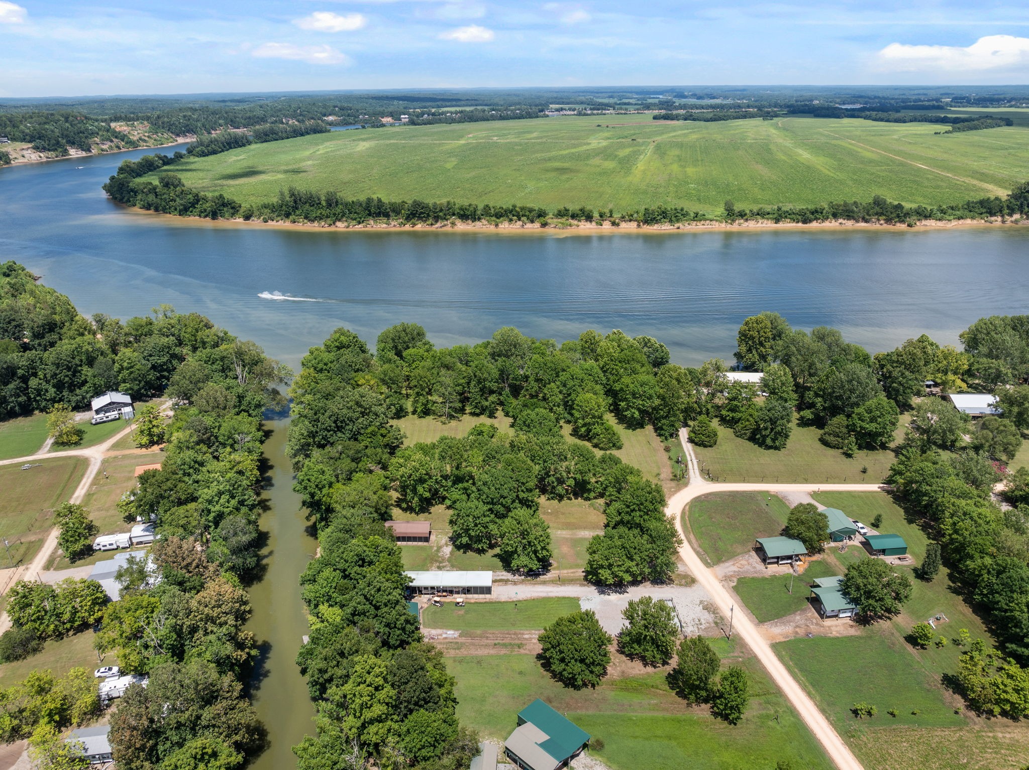 85 Bargeview Lane Adamsville, TN 38310 - Photo 29 of 44 an aerial view of residential houses with outdoor space and lake view