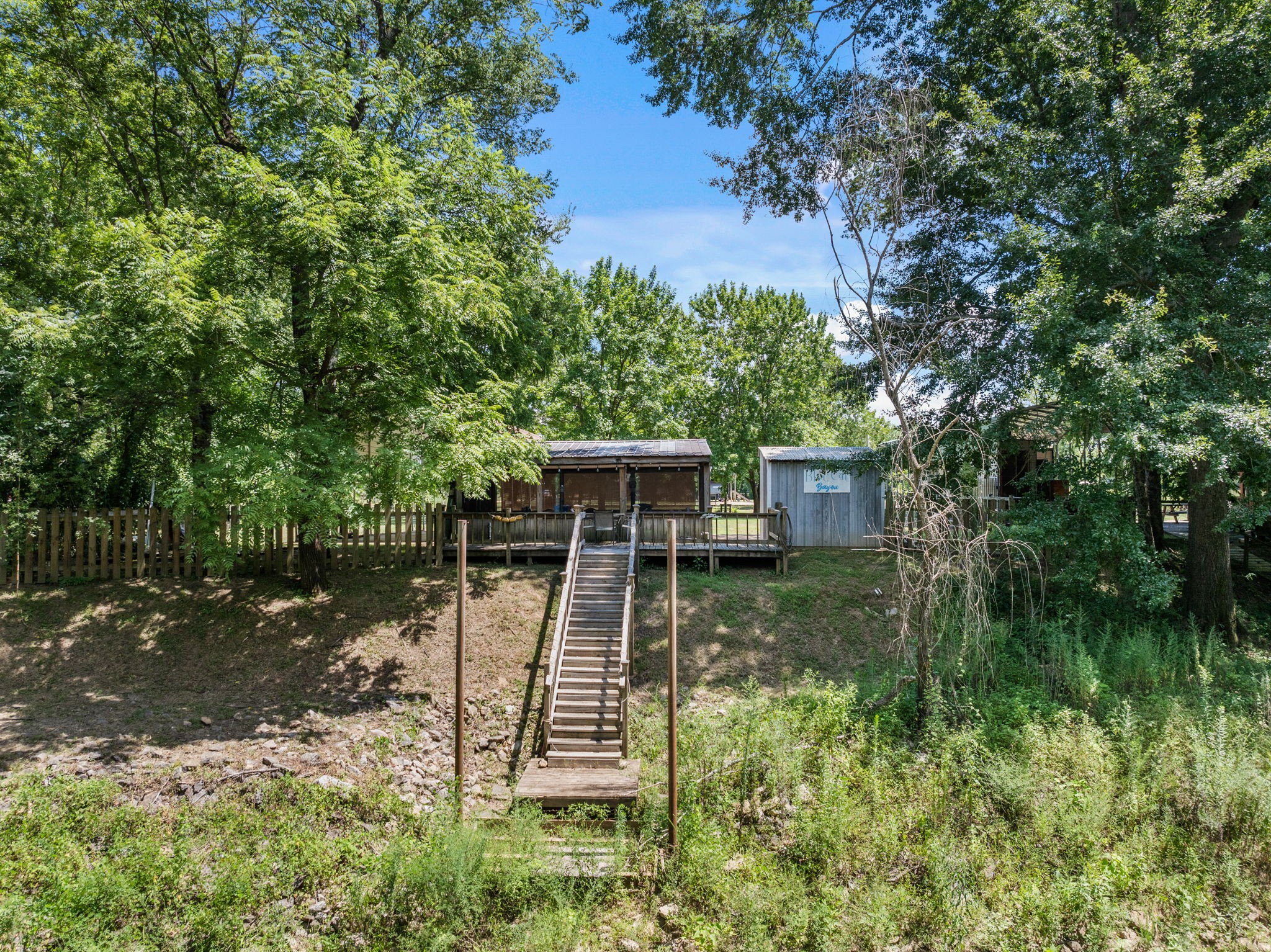 85 Bargeview Lane Adamsville, TN 38310 - Photo 37 of 44 a view of a backyard with plants and a lake view